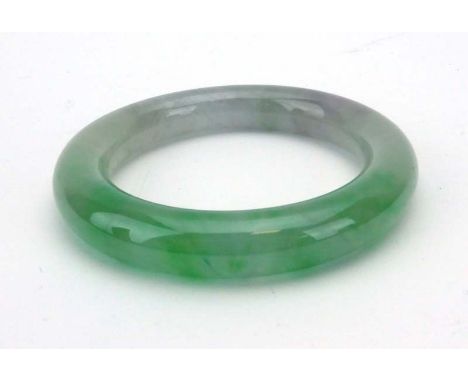 A pale green jade bangle, internal d. 5.6 cm