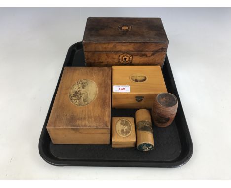 A Victorian wooden tea caddy together with two Mauchline ware boxes, one decorated with a view of Blyth Harbour, and two bodk
