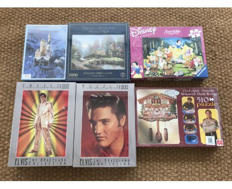Six unopened jigsaw puzzles including a blackforest clock, Disney's Snow White and Elvis etc