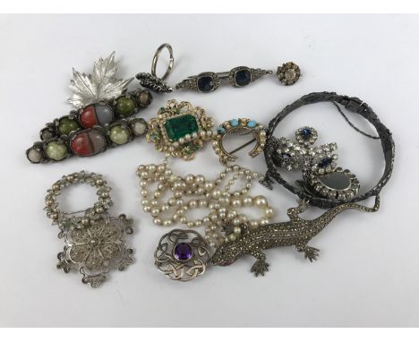 Vintage costume jewellery including a modern white-metal Celtic knot brooch set with a purple stone, and an early 20th Centur