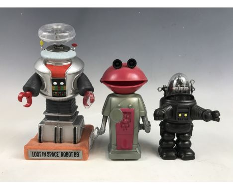 A retro Mr Smash clockwork robot together with two other robot models