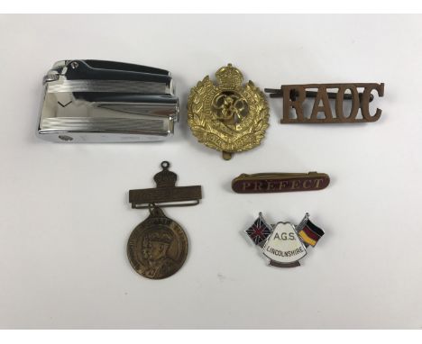 Collectors' items comprising a Ronson Varaflame lighter together with Army cap and collar badges, a Coronation medallion, Pre