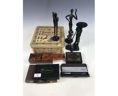 A quantity of domino sets together with a cased Parker pen, a vintage Sampler tin and sundry tribal figures etc