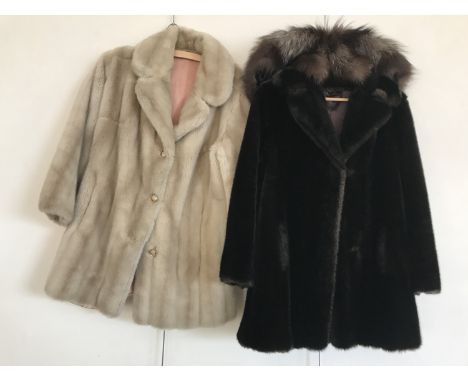A fox fur capelet together with two vintage faux fur coats 