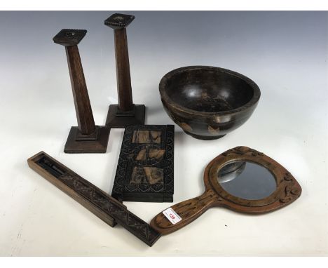 Sundry items including a wooden bowl, a carved hand mirror and a pair of candlesticks etc. 