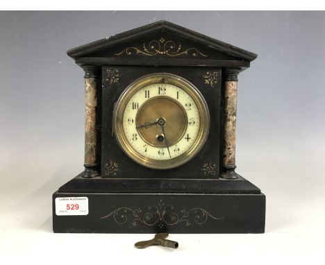 A Victorian black slate and marble mantel clock