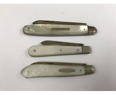 Three silver folding fruit knives with mother of pearl grip scales 