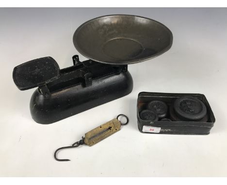 A set of vintage kitchen scales and weights, together with a pocket spring-balance