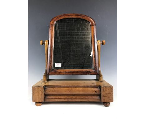 A Victorian mahogany swivel toilet mirror