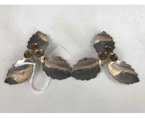 A pair of Hans Jensen of Denmark silver-plated trefoil taper sticks, having leaf form drip-pans 