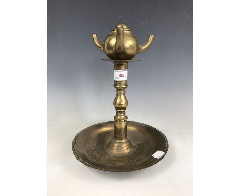A brass olive oil lamp