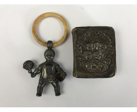 A child's novelty silver rattle in the form of a toddler carrying dumbbells, with bone teether ring (a/f), together with a si