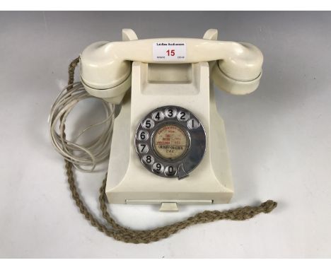 A vintage cream GPO telephone, wired for modern use