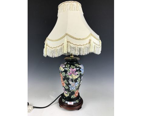 A contemporary blossom patterned table lamp