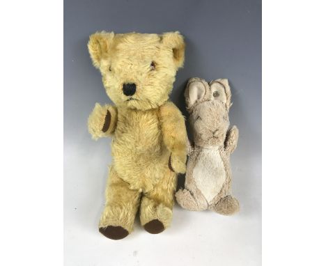 A vintage Steiff bunny rabbit, 20 cm, together with one further articulated Teddy bear, having golden mohair and a button to 