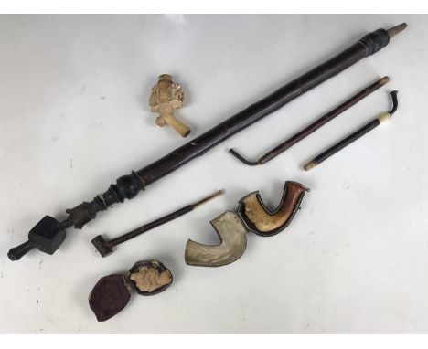Three antique meerschaum pipe bowls (a/f) and sundry German pipe stems etc