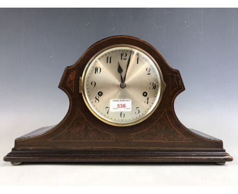 A Junghans mahogany cased mantel clock, having W200 movement with Westminster chime, in a string- and marquetry-inlaid case