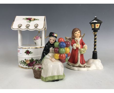 A boxed Goebel Angel with Bag and Lantern figurine together with a boxed Royal Albert musical wishing well and a Royal Doulto