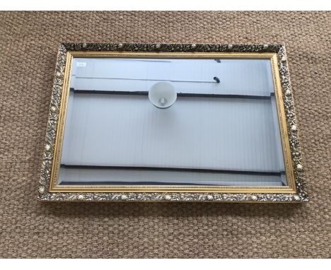 A contemporary gilt-framed oblong wall mirror, 96 x 66 cm
