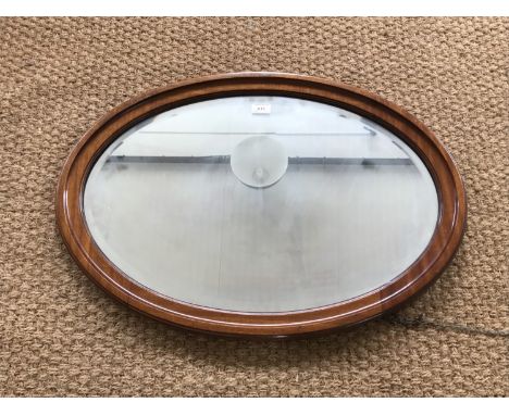 A Victorian mahogany framed oval wall mirror