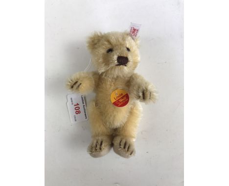 A miniature Steiff "Louie" Teddy bear, having golden mohair and articulated limbs, 14 cm 