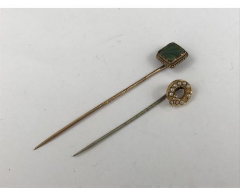 Two Victorian yellow metal stick pins, one set with split seed pearls, (pearls lacking) the other with abalone, 3.8g total