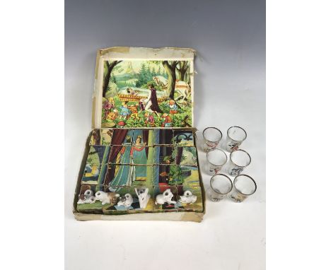Vintage childhood collectibles including bisque birthday cake candle-holders modelled as dogs and brought back during the Sec