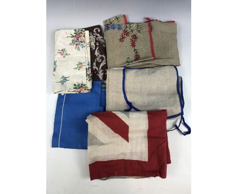 Vintage textiles including two printed cotton cushion covers and two handmade linen aprons etc.