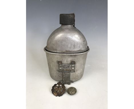 A Second World War US Army canteen, together with an RAF cap badge and a "For Loyal Service" King's Badge