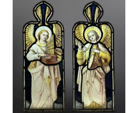 A pair of Angel Musicians, an organist and a drummer, two trapezoidal stained, painted and leaded glass windows with ogee ped