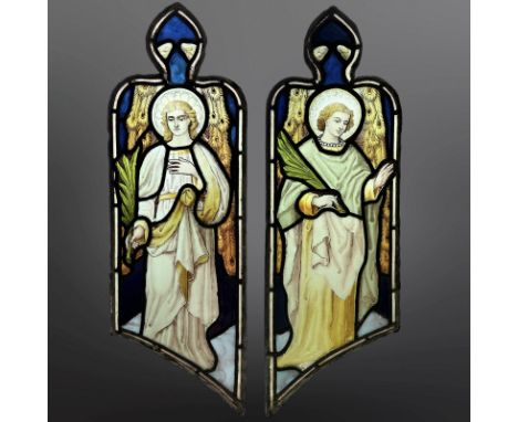 A pair of Angels holding palm branches, symbolising martyrdom, two trapezoidal stained, painted and leaded glass windows with