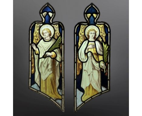 A pair of Angels holding palm branches, symbolising martyrdom, two trapezoidal stained, painted and leaded glass windows with