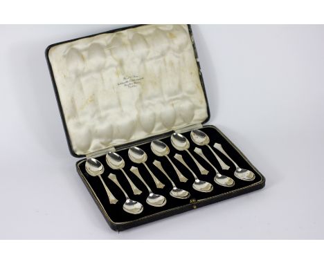 A cased set of twelve silver teaspoons W & C Sissons, Sheffield 1934, each in Art Deco design with engine turned detail, with
