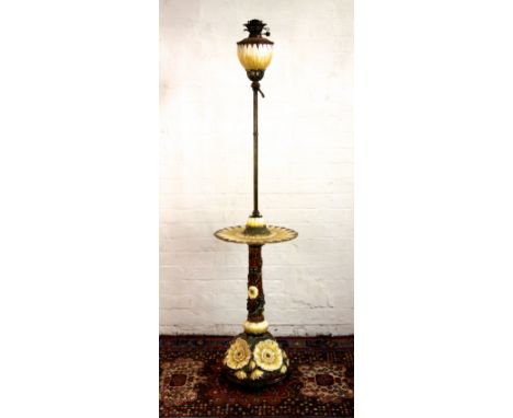 A Zsolnay Pecs brass mounted adjustable oil standard lamp, moulded throughout with sunflowers on brass scroll feet (reservoir