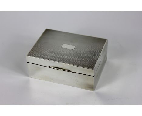 A George V engine turned silver cigarette box, Deakin & Francis, Birmingham, 1936, with vacant central cartouche and sandalwo