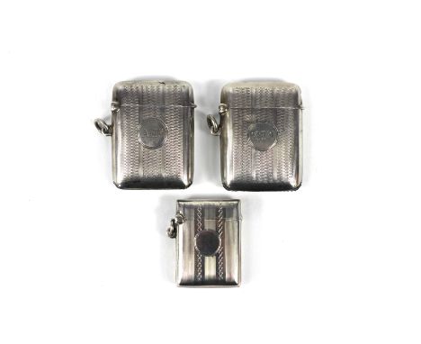 A pair of silver vesta cases Deakin and Francis, Birmingham 1925, each with engine turned design, initialled 'AMJ' & 'GMJ' 4.
