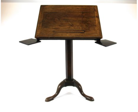 A George III mahogany reading table, with ratchet top and two candle slides, raised on carved tripod base and pad feet, 71 x 