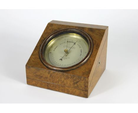 A Victorian burr walnut cased table top aneroid barometer retailed by C. W. Dixey & Son, Optician to the Queen, with silvered