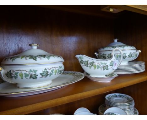 A Wedgwood 'Clara' Dinner Service, including eight large dinner plates, eight dessert plates, oval platter, two lidded terrin