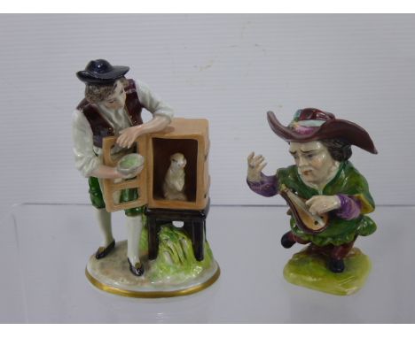 A 19th Century Sitzendorf Figure, of a boy feeding a pet rabbit, together with a Volkstedt & Co., dwarf and musician, (af).