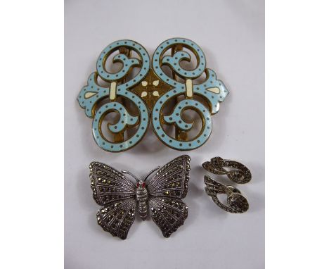 A Silver and Marcasite Butterfly Brooch, earrings and blue enamel belt buckle. (3)