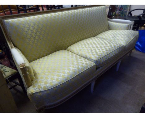 An Antique French Style Three Seat Sofa, the white paint.and gilded sofa having square back with turned arms and legs, approx