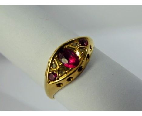 An Antique Lady's 18 ct Ruby and Diamond Ring, centre ruby 5 x 3.5 mm, 12 x 2 mm rubies, 4 x rose cut dias, circa 1918, mm JW