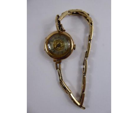 A Lady's 9 ct (375) Cocktail Watch, engine turned face on rolled gold bracelet, 13714 stamp, in the original box.