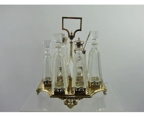 A Silver Plated Edwardian Cruet Set, together with a cut glass enamel topped scent bottle with the original glass stopper. (a