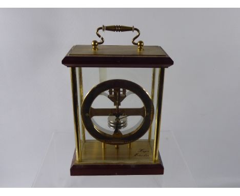 A Huger Meteobar Table Barometer, teak, glass and brass case, approx 27 x 17 cms with brass carry handle.