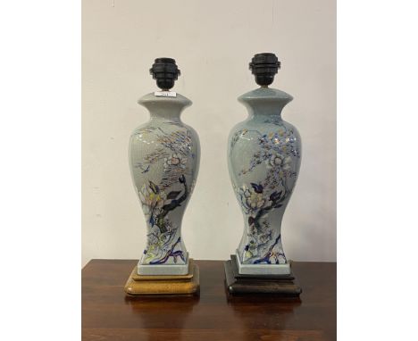 A pair of Chinese style crazed ceramic table lights of baluster vase form, each on a hardwood base, H43cm