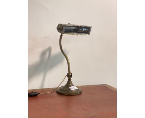 An early 20th century articulated brass desk light, H37cm