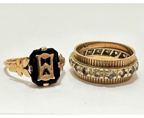 A 9ct gold onyx and gold mounted signet style ring with leaf, a/f (k), and a yellow metal eternity style ring set with clear 