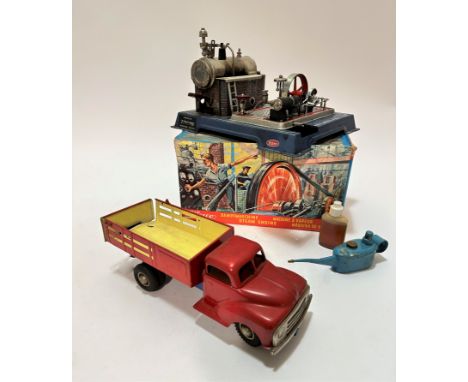 A West German tin plate model of a 1950s dumper truck, (10cm x 30cm x 9.5cm) complete with tyres, paint work is in good to ve